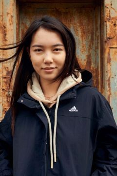 adidas-girl-in-front-of-rusted-background