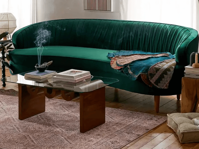 Cozy up to the curved sofa trend
