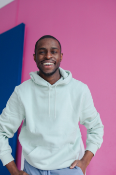 man-in-hoodie-with-pink-background