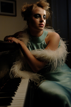women-in-vintage-outfit-on-piano